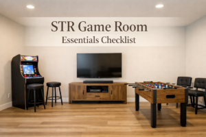STR game room essentials with arcade game, TV, and seating designed for guest use